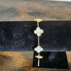 Elegant Gold and White Clover Bracelet